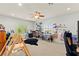 Bright loft with multiple workstations, natural light, and cozy carpeting at 7641 Lani Dawn St, Las Vegas, NV 89149