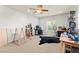 Spacious loft area with comfortable carpeting, ceiling fan, and plenty of room for activities at 7641 Lani Dawn St, Las Vegas, NV 89149
