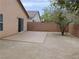 Backyard showcasing desert landscaping, a privacy wall, and small trees at 7924 Pale Rider St, Las Vegas, NV 89131