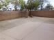 Spacious backyard area featuring a neutral landscape with a brick wall, ideal for outdoor activities and relaxation at 7924 Pale Rider St, Las Vegas, NV 89131