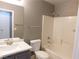 Bathroom boasts a shower-tub combination, tiled walls, vanity sink and mirror at 7924 Pale Rider St, Las Vegas, NV 89131