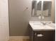 Bathroom featuring vanity sink, mirror, and a towel rack at 7924 Pale Rider St, Las Vegas, NV 89131