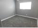 Bedroom features neutral colored walls, carpet, and a window at 7924 Pale Rider St, Las Vegas, NV 89131