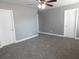 Bedroom with neutral color walls, carpeted flooring, and ceiling fan at 7924 Pale Rider St, Las Vegas, NV 89131