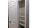 Linen closet with built-in shelves and a neutral-colored interior at 7924 Pale Rider St, Las Vegas, NV 89131