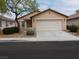 Charming single-story home featuring a two-car garage and well-maintained landscaping in a residential neighborhood at 7924 Pale Rider St, Las Vegas, NV 89131