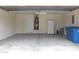 Clean, well-lit two-car garage offering ample storage space with an extra refrigerator and new water heater at 7924 Pale Rider St, Las Vegas, NV 89131