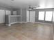 Neutral living area with tile flooring, ceiling fan, and updated lighting at 7924 Pale Rider St, Las Vegas, NV 89131