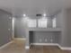 Living area with tile flooring, updated lighting, and gray walls at 7924 Pale Rider St, Las Vegas, NV 89131