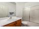 Cozy bathroom featuring a shower and bathtub combination, alongside a vanity with storage at 7927 Crested Starling Ct, North Las Vegas, NV 89084