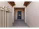 Close-up of the secure, gated front entryway with desert-themed door design at 7927 Crested Starling Ct, North Las Vegas, NV 89084