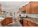 Kitchen area features granite countertops, stainless appliances, and views of eat-in nook at 7927 Crested Starling Ct, North Las Vegas, NV 89084