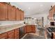 This kitchen features granite countertops, stainless steel appliances, and sleek cabinetry at 7927 Crested Starling Ct, North Las Vegas, NV 89084
