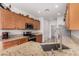 This kitchen features stainless steel appliances and stylish countertops. The perfect space for cooking and gathering at 7927 Crested Starling Ct, North Las Vegas, NV 89084