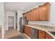 Kitchen features stainless steel appliances, updated cabinets, and granite countertops at 7927 Crested Starling Ct, North Las Vegas, NV 89084