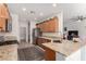 Bright kitchen with granite countertops, stainless appliances, and views into the living area at 7927 Crested Starling Ct, North Las Vegas, NV 89084