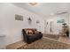 Cozy living room with neutral walls, plush carpeting, and easy access to a full bathroom at 7927 Crested Starling Ct, North Las Vegas, NV 89084