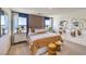 Comfortable bedroom boasting bright natural light, a striped accent wall, and coordinated modern decor at 799 Calm Crystal Ct # Lot 142, North Las Vegas, NV 89081