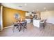 Bright dining area featuring a stylish round table and chairs next to a modern kitchen at 799 Calm Crystal Ct # Lot 142, North Las Vegas, NV 89081