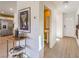 Inviting entryway with wood-look floors, white walls, and view to a bright half-bathroom at 799 Calm Crystal Ct # Lot 142, North Las Vegas, NV 89081
