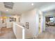 Bright upstairs hallway featuring carpet, artwork, and access to bedrooms and bathrooms at 799 Calm Crystal Ct # Lot 142, North Las Vegas, NV 89081