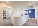 Well-lit second floor hallway featuring carpet, white walls, and doors leading to various rooms at 799 Calm Crystal Ct # Lot 142, North Las Vegas, NV 89081