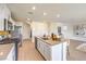 Well-lit kitchen featuring modern appliances, a central island, and ample storage space at 799 Calm Crystal Ct # Lot 142, North Las Vegas, NV 89081