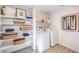 Well-organized laundry room with shelves, baskets, and modern washer and dryer at 799 Calm Crystal Ct # Lot 142, North Las Vegas, NV 89081