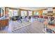 Open-concept living room with wood-look floors and lots of light from large picture windows at 799 Calm Crystal Ct # Lot 142, North Las Vegas, NV 89081