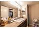 The bathroom includes a vanity with granite countertop and a sliding door to the bedroom at 8101 W Flamingo Rd # 2006, Las Vegas, NV 89147