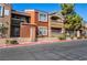 Multi-colored condo building with wrought iron fencing and lush green landscaping at 8101 W Flamingo Rd # 2006, Las Vegas, NV 89147