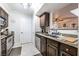 Well-lit kitchen with stainless steel appliances, dark wood cabinets, and a view into the dining area at 8101 W Flamingo Rd # 2006, Las Vegas, NV 89147