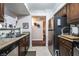 Features of the kitchen include a stainless steel refrigerator, ample countertop space, and dark wood cabinets at 8101 W Flamingo Rd # 2006, Las Vegas, NV 89147