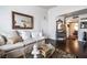 Stylish living room with hardwood floors, neutral paint, and decorative mirror at 8101 W Flamingo Rd # 2006, Las Vegas, NV 89147