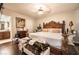 A lavish main bedroom includes a king bed, decorative furnishings, and an attached bathroom at 8101 W Flamingo Rd # 2006, Las Vegas, NV 89147