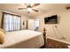 The main bedroom offers a king bed, ceiling fan, and a mounted television for comfort at 8101 W Flamingo Rd # 2006, Las Vegas, NV 89147