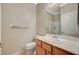 Clean bathroom with a single sink vanity, toilet, and shower with glass door, perfect for guests at 8129 Jim Steele Falls St, North Las Vegas, NV 89085