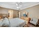 Comfortable bedroom featuring a ceiling fan, carpet, and neutral walls at 8129 Jim Steele Falls St, North Las Vegas, NV 89085