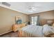 Comfortable bedroom featuring a ceiling fan, carpet, and sliding glass doors to the backyard at 8129 Jim Steele Falls St, North Las Vegas, NV 89085