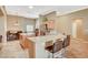 Spacious kitchen featuring an island, breakfast bar, stainless steel appliances, and adjoining dining area at 8129 Jim Steele Falls St, North Las Vegas, NV 89085