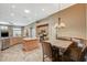 Spacious eat-in kitchen with wooden cabinets, island, and stainless steel dishwasher at 8129 Jim Steele Falls St, North Las Vegas, NV 89085