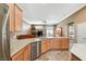Modern kitchen with granite countertops, stainless steel appliances, and open to the living space at 8129 Jim Steele Falls St, North Las Vegas, NV 89085