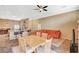 Open-concept living and dining area with a breakfast bar, comfortable seating, and tiled floors at 8129 Jim Steele Falls St, North Las Vegas, NV 89085
