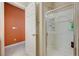 Modern shower with glass enclosure, tiled walls, and built-in shelving, offering a spa-like experience at 8129 Jim Steele Falls St, North Las Vegas, NV 89085