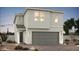 Two-story home featuring a two-car garage and modern architectural style at 8148 Rockflower St, Las Vegas, NV 89113