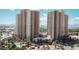 Stunning high-rise condo towers with lush landscaping, circular driveway, and a resort-style entrance at 8255 S Las Vegas Blvd # 1514, Las Vegas, NV 89123