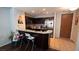 Well-equipped kitchen with breakfast bar, stainless steel appliances, and stylish tile backsplash at 8255 S Las Vegas Blvd # 1514, Las Vegas, NV 89123