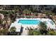 Relaxing pool area surrounded by palm trees, lounge chairs, and umbrellas, perfect for outdoor enjoyment at 8255 S Las Vegas Blvd # 1514, Las Vegas, NV 89123
