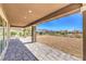 Outdoor patio overlooking the backyard with desert landscaping and mountain views at 8316 Broad Peak Dr, Las Vegas, NV 89131