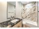 Bathroom featuring marble accents, soaking tub, and vanity at 8316 Broad Peak Dr, Las Vegas, NV 89131